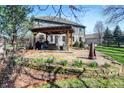 Outdoor seating area with charming pergola, patio, and mature landscaping at 545 Walnut Woods Dr, Greenwood, IN 46142