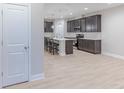 Beautiful kitchen with stainless steel appliances, gray cabinetry, and a central island with seating at 5790 Arcade Blvd, McCordsville, IN 46055