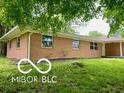 A quaint single-story home featuring a brick exterior and ample windows at 6373 E Hadley Rd, Mooresville, IN 46158