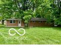 Single story brick home situated on a green lawn at 6373 E Hadley Rd, Mooresville, IN 46158