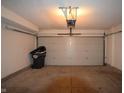 Empty two car garage with white walls and garage door at 708 Mountain Pine Dr, Greenwood, IN 46143