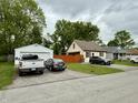 Lovely home with a detached garage, showcasing curb appeal in a serene neighborhood setting at 710 Bacon St, Indianapolis, IN 46227