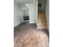 Bright living room with hardwood floors and stairs to the second level at 830 Villa Ave, Indianapolis, IN 46203