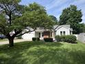 Landscaped front yard and charming exterior of this well-maintained single-Gathering home at 912 Delray Dr, Indianapolis, IN 46241