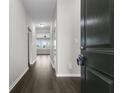 Inviting home foyer featuring wood floors and views through to the living room at 11815 Adair Pl, Indianapolis, IN 46229