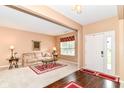 Inviting living room with plush carpet, neutral tones, and ample natural light at 12994 Dekoven Dr, Fishers, IN 46037