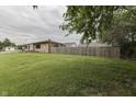 Lush backyard with a wooden fence, perfect for outdoor activities and privacy at 1601 Southern Ave, Beech Grove, IN 46107