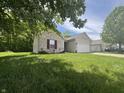 Beautiful one-story home with a well-manicured lawn and attached garage at 167 Hilltop Farms Blvd, New Whiteland, IN 46184