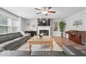 Inviting living room with a fireplace, piano, and comfortable seating area at 19534 Forsythe Dr, Noblesville, IN 46060