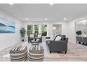 Bright living room with modern furnishings, large windows, and a cozy atmosphere at 2105 Mayfair Dr, Indianapolis, IN 46260