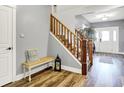 Inviting foyer with hardwood floors, staircase, and a view of the front door at 241 N Liberty Blvd, Mooresville, IN 46158