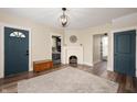 Bright living room with hardwood floors, a decorative fireplace, and neutral paint at 3360 Main St, Plainfield, IN 46168