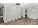 Spacious bedroom featuring stylish wood-look floors and neutral wall color at 3409 S Rural St, Indianapolis, IN 46237