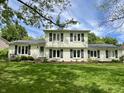 Charming two-story home with a light blue door and lush green lawn at 377 4Th E Ct, Carmel, IN 46033
