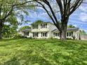Charming two-story home with lush green lawn and mature landscaping at 377 4Th E Ct, Carmel, IN 46033