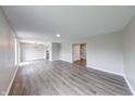 Spacious living room featuring modern flooring, neutral paint, and ample natural light at 4056 Orchard Valley Ln, Indianapolis, IN 46235