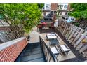 Private backyard featuring a patio with outdoor furniture and lush greenery at 536 Lockerbie S Cir, Indianapolis, IN 46202