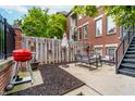 Cozy backyard patio with stylish outdoor furniture and a barbecue grill at 536 Lockerbie S Cir, Indianapolis, IN 46202