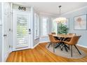 Cozy dining area with a round table, stylish chairs, and door with windows at 536 Lockerbie S Cir, Indianapolis, IN 46202