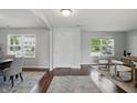Bright and airy living room with hardwood floors and modern furniture, illuminated by natural light at 6552 Hunters S Rdg, Zionsville, IN 46077