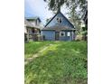 Exterior shot showing backyard with shed and full grass lawn at 764 Haugh St, Indianapolis, IN 46222