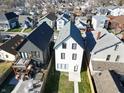 An aerial view displays the home's location, backyard patio, and hot tub at 811 E Minnesota St, Indianapolis, IN 46203