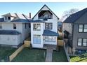 Charming two-story home featuring a sleek design, ample natural light, and a welcoming front entrance at 811 E Minnesota St, Indianapolis, IN 46203