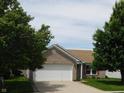 Charming single-Gathering home with brick facade, attached garage, and well-maintained lawn at 8346 Weathervane Cir, Indianapolis, IN 46239