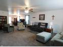 Spacious living room with large windows, neutral paint, and plenty of room for seating arrangements at 8346 Weathervane Cir, Indianapolis, IN 46239