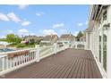 Spacious outdoor deck overlooks the waterfront and landscaped community, offering a serene setting at 11065 Spice Ln, Fishers, IN 46037
