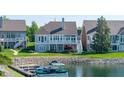 Back of home and yard featuring water access with boat and boat dock at 11065 Spice Ln, Fishers, IN 46037