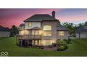 Charming brick home featuring a backyard patio and deck, ideal for outdoor entertaining at 14711 Macduff Dr, Noblesville, IN 46062