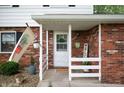 Inviting front porch with 'Welcome' sign, decorative plants, and charming decor details at 1495 E 240 N, Anderson, IN 46012