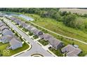Beautiful aerial view of a neighborhood featuring a pond and walking trails throughout the community at 1539 Hazy Falls Blvd, Westfield, IN 46074