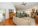 Spacious living room with hardwood floors, fireplace, and ample natural light from large windows at 16126 Hymera Green, Westfield, IN 46074