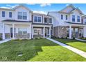 Charming townhomes showcasing well-manicured lawns and inviting front entrances at 19450 Northwest Dr, Westfield, IN 46074