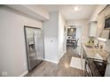 Well-lit kitchen featuring stainless steel appliances, modern cabinetry, and hardwood floors at 2235 N Kenwood Ave, Indianapolis, IN 46208