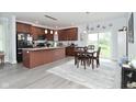 Open kitchen and dining area featuring modern appliances and hardwood floors at 2330 Oak Dr, Clayton, IN 46118