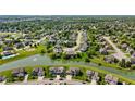 An aerial view showing a beautiful neighborhood with ponds and lots of mature trees at 2447 Stonehaven Dr, Avon, IN 46123