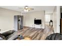 Spacious living room features modern floors and a stainless steel refrigerator in the corner at 2538 Sickle Rd, Indianapolis, IN 46219