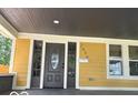 Charming covered porch with newly painted address and exterior lighting at 2936 Guilford Ave, Indianapolis, IN 46205