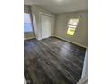 Cozy bedroom showcasing sleek vinyl floors, a double door closet, and bright, natural light at 315 Schoolhouse Rd, Franklin, IN 46131