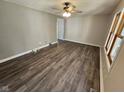 Spacious living room boasting stylish vinyl flooring, ceiling fan, and neutral wall colors at 315 Schoolhouse Rd, Franklin, IN 46131