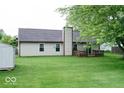 Backyard view showcasing a wooden deck area and green lawn at 444 Austin Dr, Avon, IN 46123