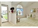 Bright living room featuring a large window, vaulted ceiling, and comfortable seating arrangement at 4528 Hunt Master Ct, Indianapolis, IN 46268
