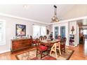 Elegant dining room with hardwood floors, natural light, and a classic dining set, ideal for Gathering gatherings at 518 N Emerson Ave, Indianapolis, IN 46219