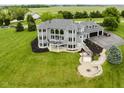 Beautifully landscaped backyard with stone firepit and patio at 5758 N 900 W, Thorntown, IN 46071