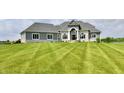 Charming home featuring stone accents, large windows, and a well-manicured lawn at 5758 N 900 W, Thorntown, IN 46071