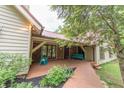 Charming front porch with a brick facade, a cozy seating area, and a welcoming walkway at 5821 Bittersweet Rd, Morgantown, IN 46160