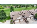 Stunning aerial view showcasing townhome with two-car garage, lush greenery and golf course views at 608 Cielo Vista Dr, Greenwood, IN 46143